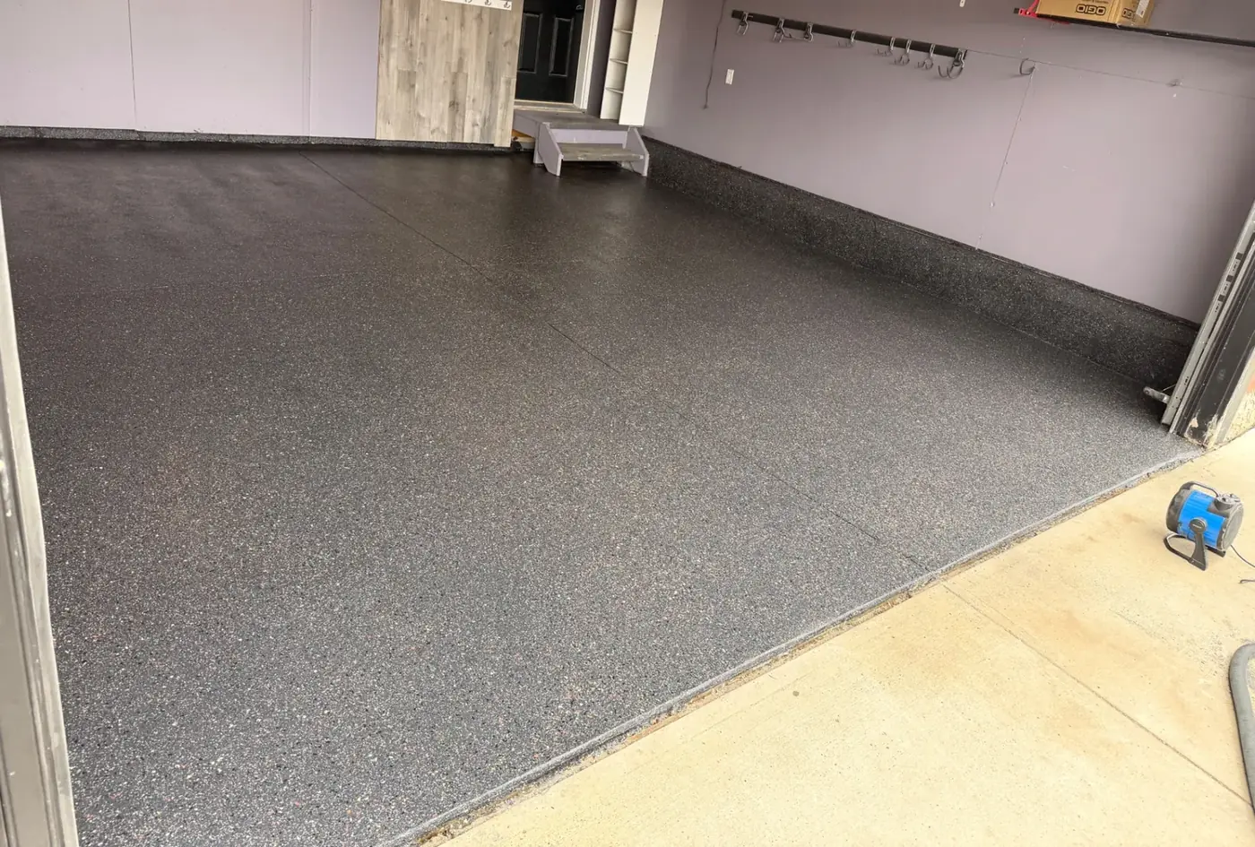 Finished Blacktop flake epoxy garage floor
