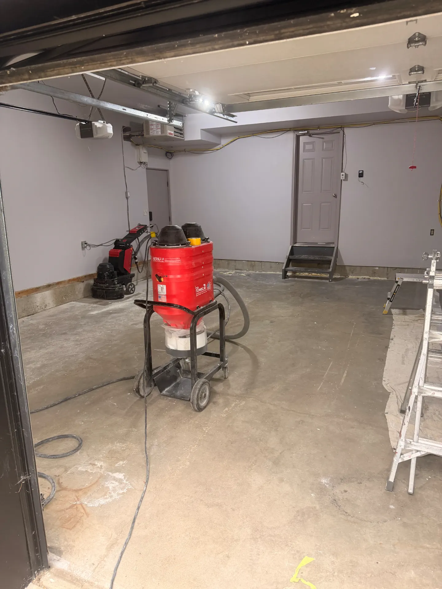 Garage floor during concrete preparation before coating