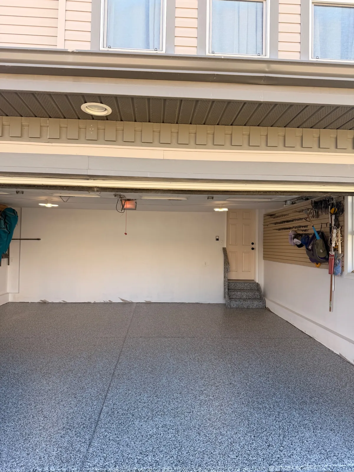 Interior garage stairs coated in grey flake epoxy