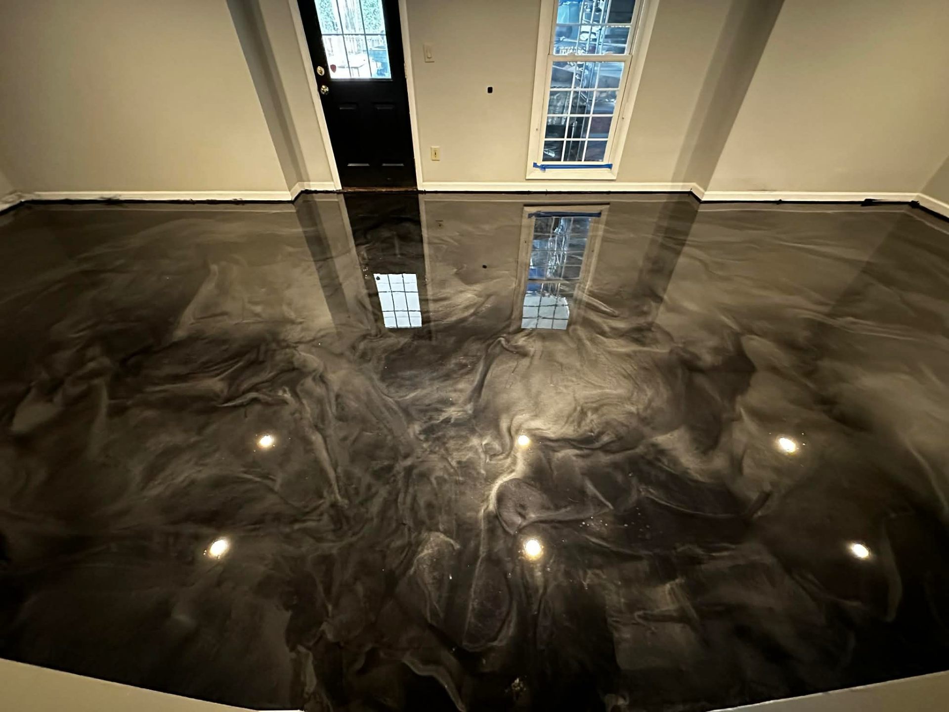 Dark metallic swirl epoxy entryway